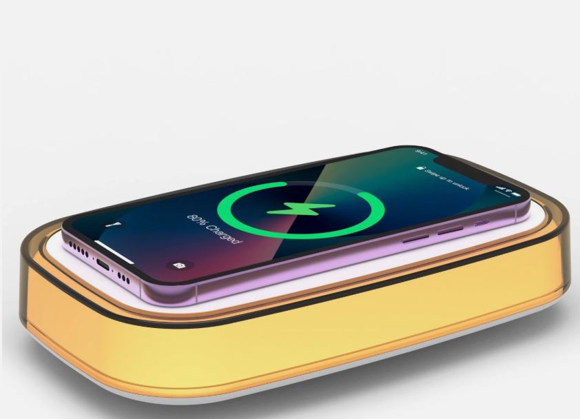 Caricatore wireless da tavolo giallo con luce LED multicolore e telefono in ricarica