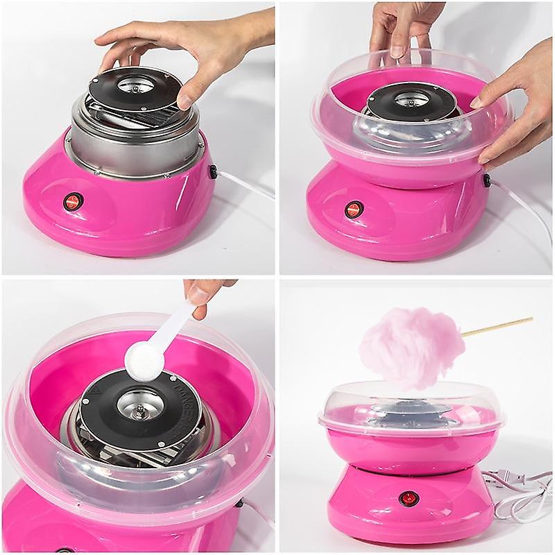 Macchina per zucchero filato rosa con cupola trasparente e mani durante il montaggio