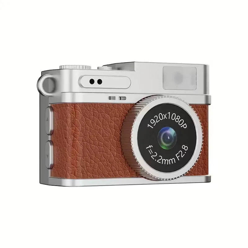 Mini fotocamera portachiavi retrò con scocca argento e inserti marroni, obiettivo frontale.