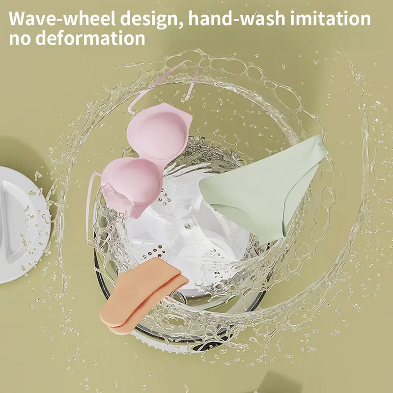 Mini lavatrice portatile con coperchio trasparente e vasca con acqua e indumenti