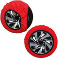 Set di 2 calze da neve rosse con inserti per ruote, viste frontali.