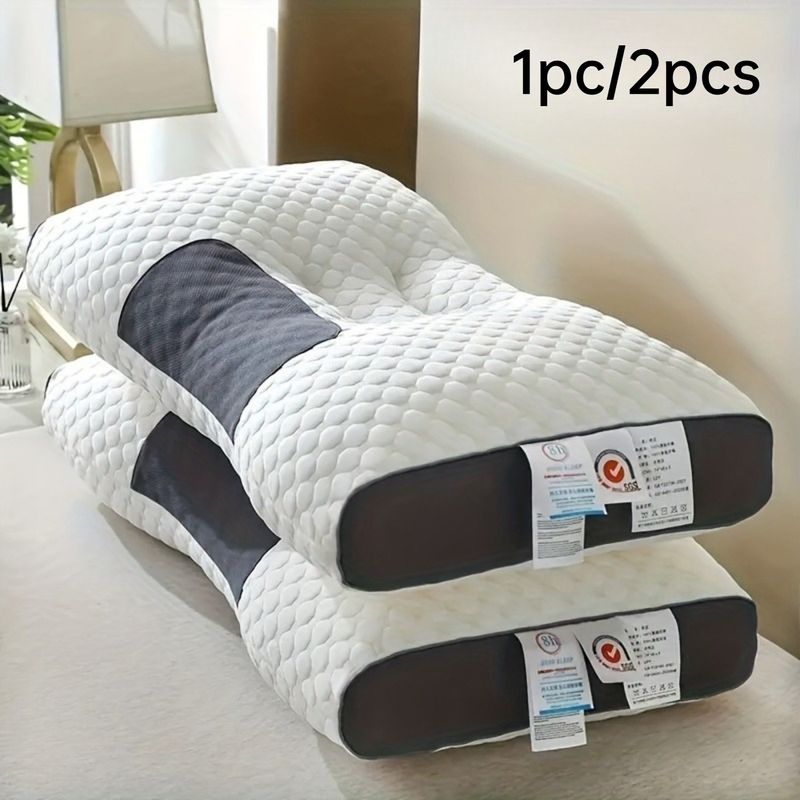 Cuscino ergonomico sagomato bianco con supporti scuri per collo e testa