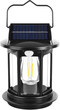 Lanterna solare portatile nera con pannello solare e maniglia ad arco, luce LED trasparente