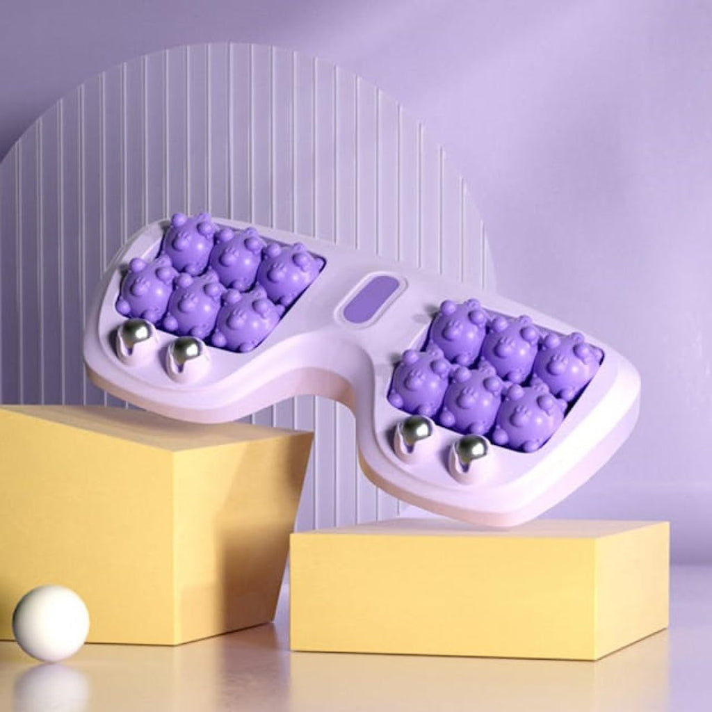 Massaggiatore plantare con rulli viola e sfere metalliche, posizionato su supporto