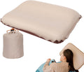 Cuscino gonfiabile beige per collo, sagoma a mezzaluna con bordo arricciato