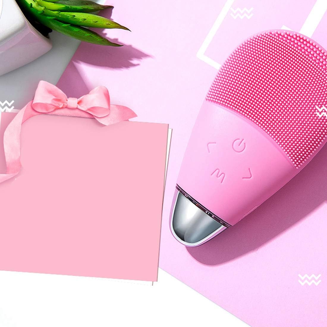 Spazzola elettrica per pulizia del viso rosa con testina a puntini, parte superiore