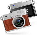 Mini fotocamera portachiavi retrò con scocca argento e inserti marroni, lente frontale.