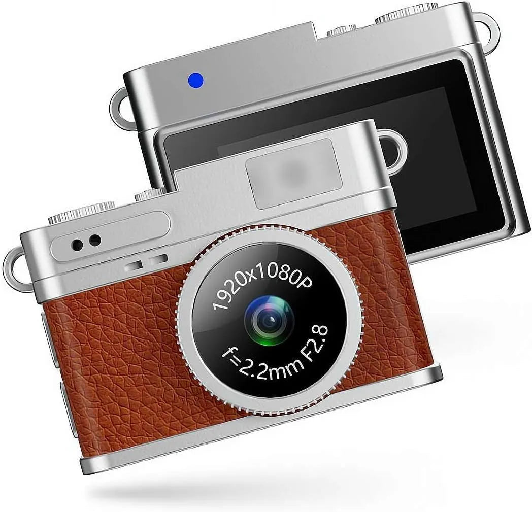 Mini fotocamera portachiavi retrò con scocca argento e inserti marroni, lente frontale.