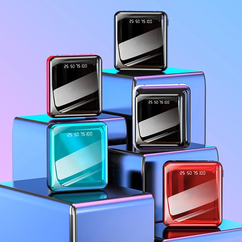 Power bank compatto con display LED quadrato, scocca scura e cavi integrati