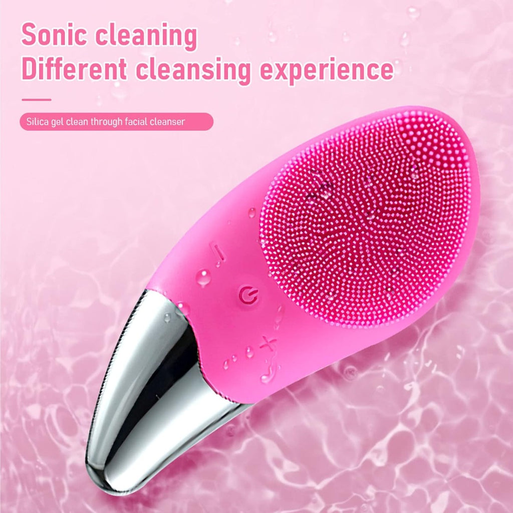 Spazzola elettrica viso in silicone rosa con setole a puntini e gocce d’acqua