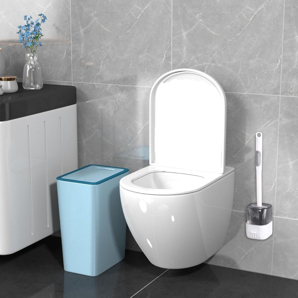 Scopino per WC con base cilindrica trasparente e manico bianco