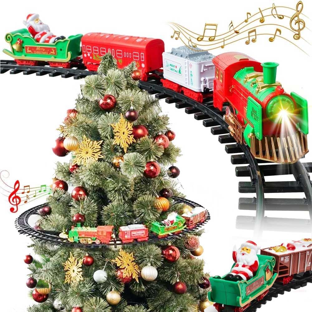 Trenino natalizio elettrico su binari: locomotiva nera e rossa con luci vicino all’albero.