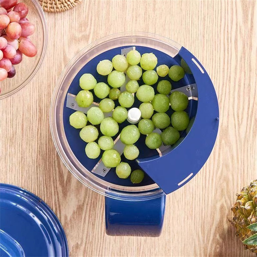 Sbucciatrice elettrica blu con ciotola trasparente piena di uva verde