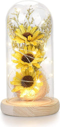 Cupola di vetro con girasoli artificiali gialli e base in legno con luci LED