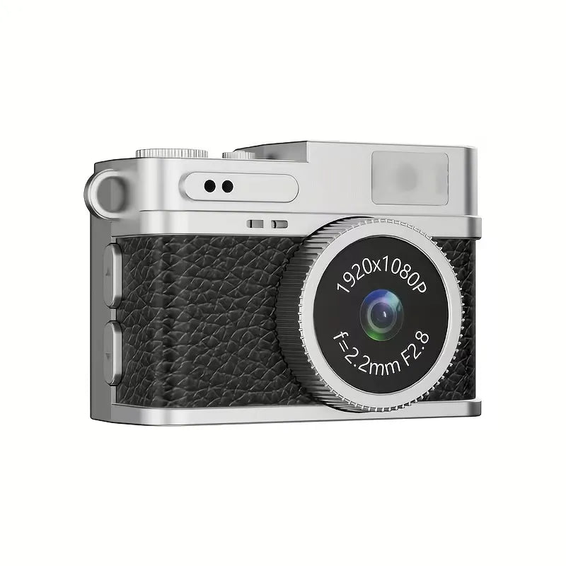 Mini fotocamera portachiavi con corpo nero goffrato, lente rotonda e scocca argento.