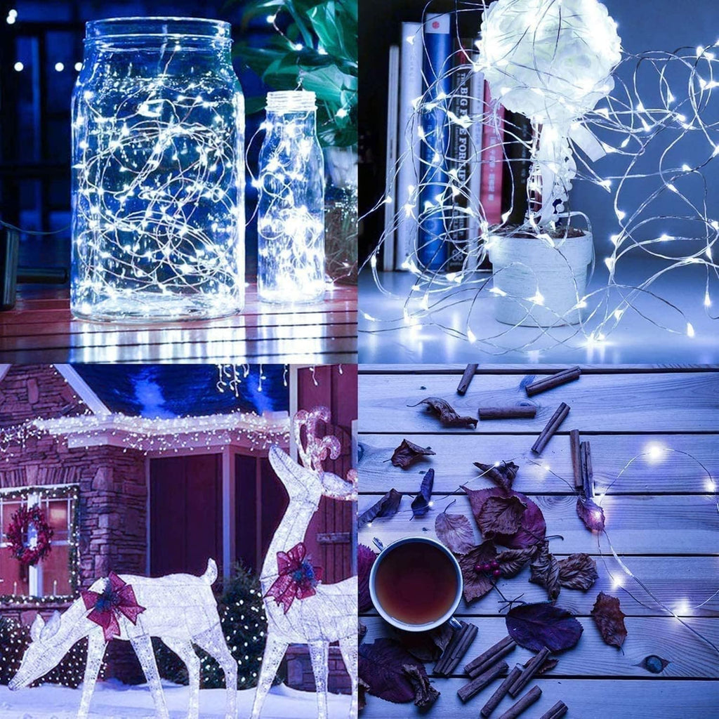 Luci natalizie a filo con 300 LED bianchi accese attorno a barattoli e decorazioni