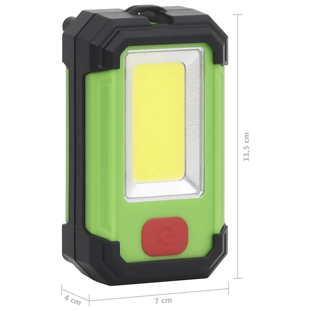 Faretto solare LED portatile verde/nero con dimensioni 7×4 cm e 11,5 cm.