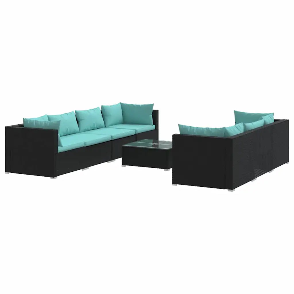 Set lounge da esterno: divani in polyrattan nero con cuscini turchese e tavolino.
