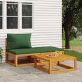 Set mobili da giardino: divanetto in legno con cuscino verde e tavolino in legno