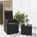 Poltrona e tavolino da giardino in polyrattan nero, con cuscino imbottito
