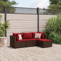 Divano angolare in polyrattan marrone con cuscini rossi e cuscino decorativo bianco