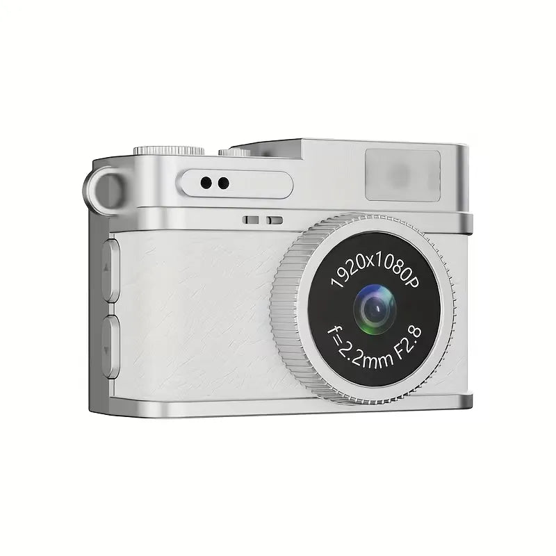 Mini fotocamera portachiavi con corpo bianco goffrato, lente rotonda e scocca argento.