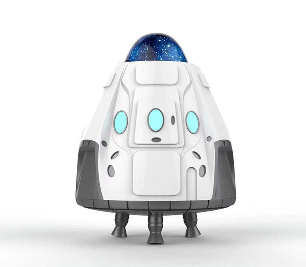 Projecteur a capsule spatiale blanc con oblò blu e base a tre piedini