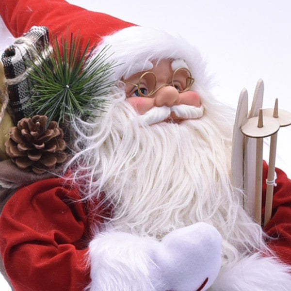Babbo Natale 40 cm in tessuto, primo piano: barba bianca, occhiali, candele e pigne