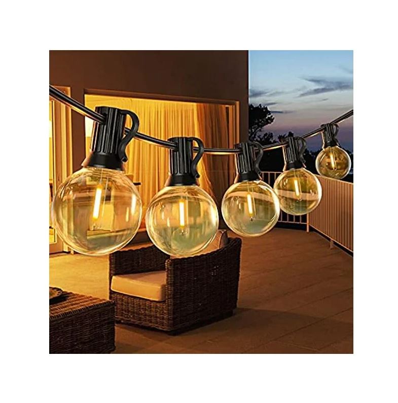 Catena di lampadine solari a globo con fili neri e bulbi trasparenti, stile vintage