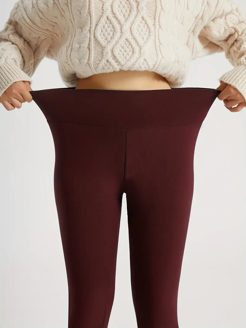 Leggings imbottiti rosso scuro con cucitura centrale e bordo pile bianco