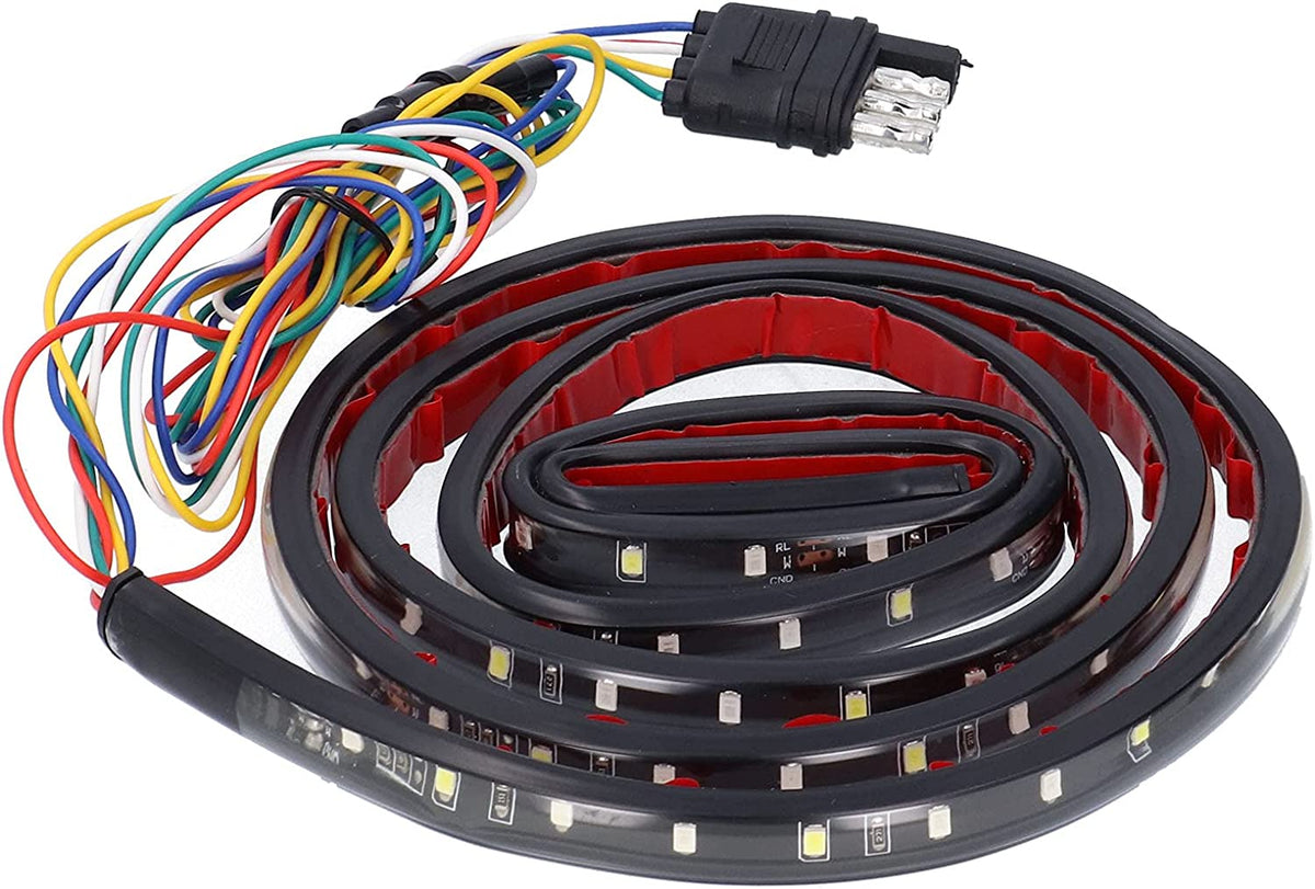 Striscia LED adesiva nera arrotolata con cablaggio multicolore e connettore