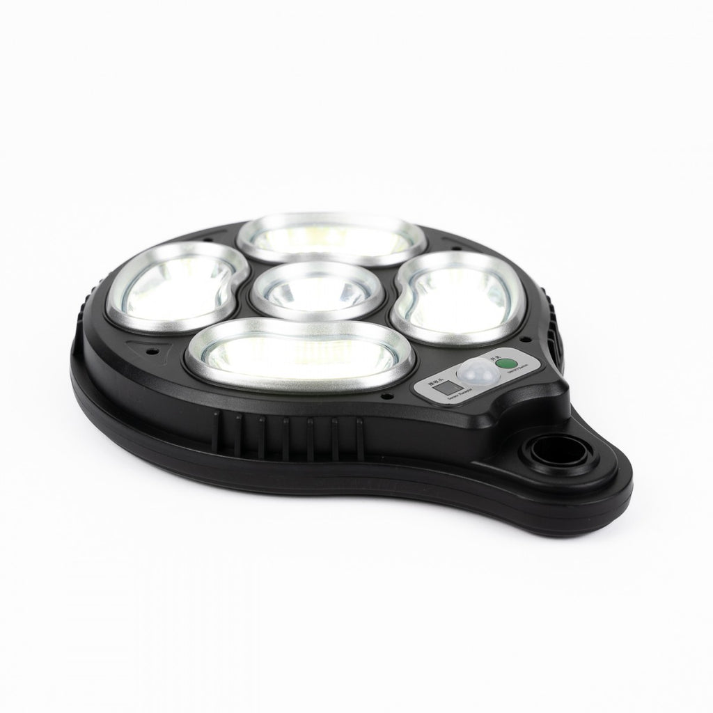 Proiettore solare nero a base piatta con 5 ottiche LED e sensore integrato.
