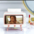 Porta fazzoletti a forma di TV bianco e rosa, con fazzoletto inserito e piedini rosa