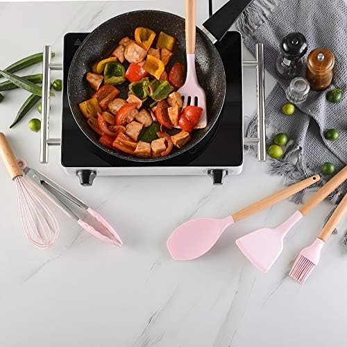 Utensili da cucina rosa in silicone con spatole e frusta, manici in legno