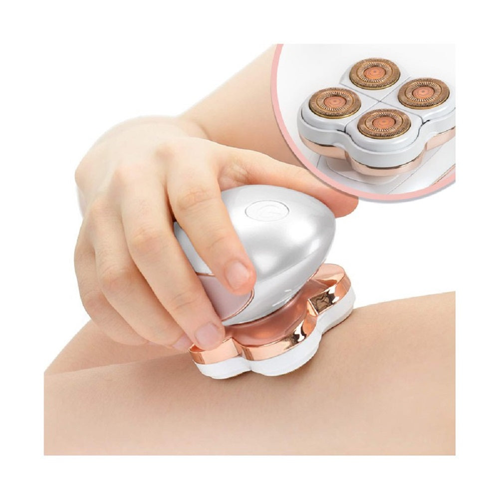 Mini epilatore portatile bianco-rosa con testine dorate in uso su gamba