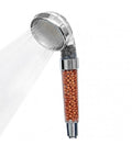 Soffione doccia portatile cromato con serbatoio trasparente di sali minerali marroni