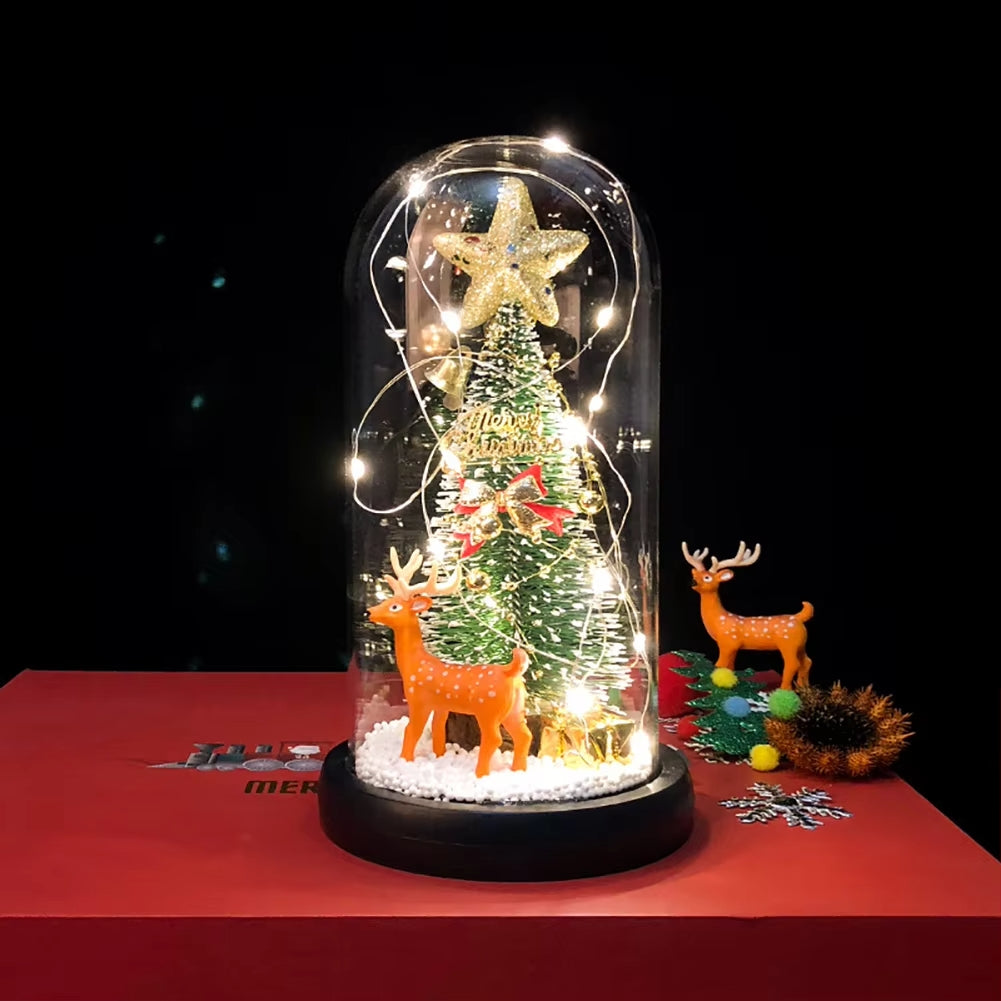 Cupola di vetro con luci LED e personaggi natalizi: albero e renne su base nera