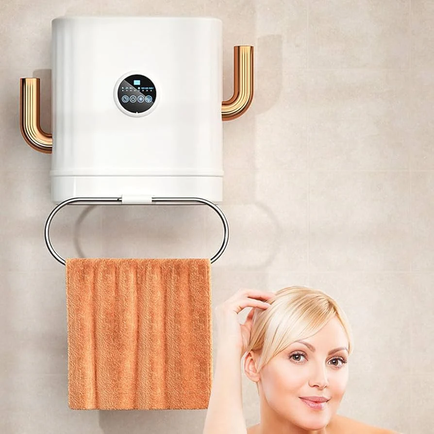 Termoconvettore elettrico a parete bianco con tubi dorati e asciugamano arancione
