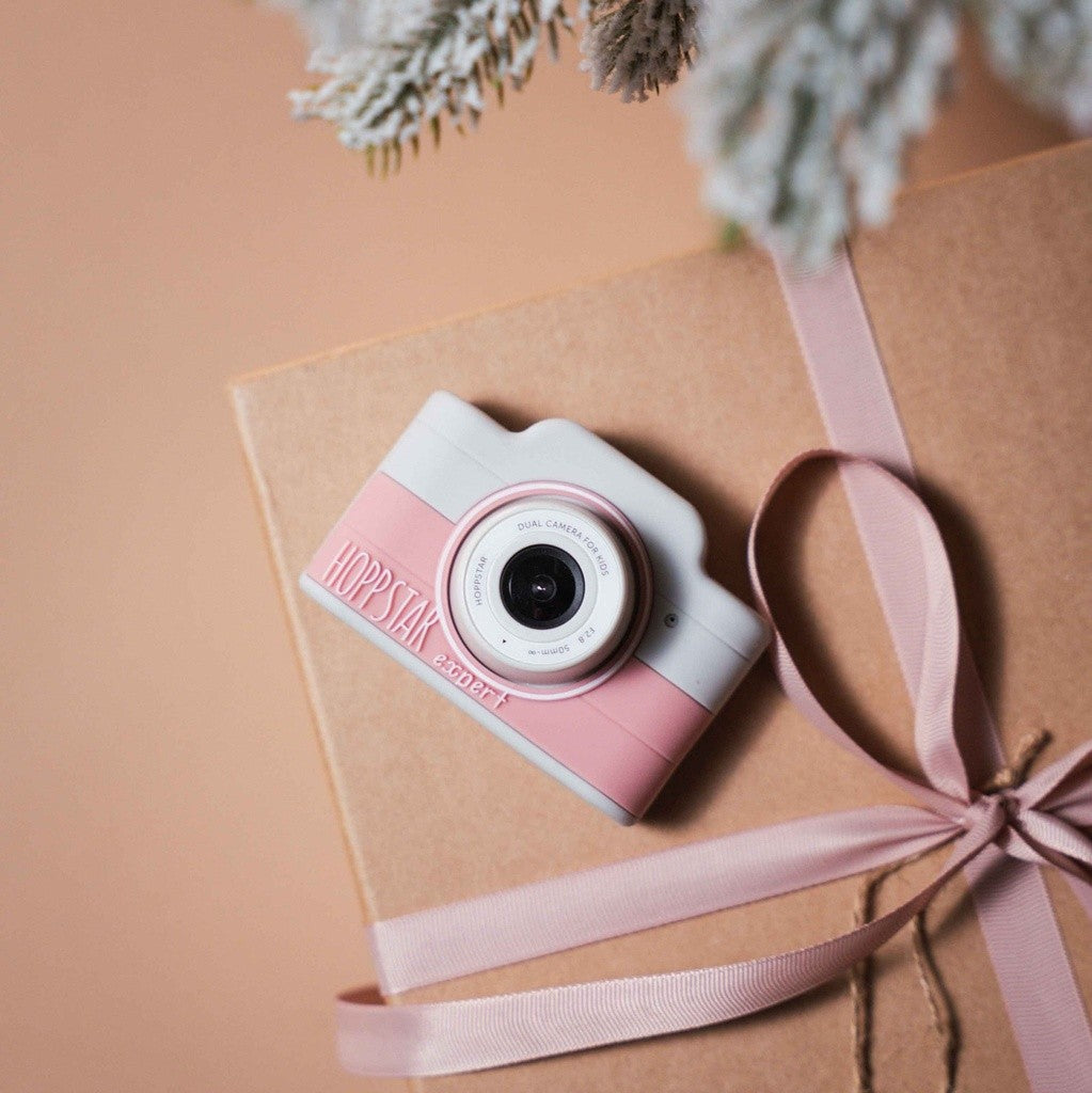 Fotocamera per bambini rosa su confezione regalo, con tracolla