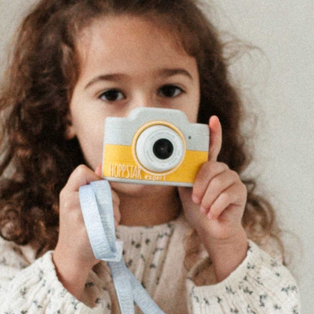 Fotocamera per bambini azzurra e gialla con cinghia e obiettivo