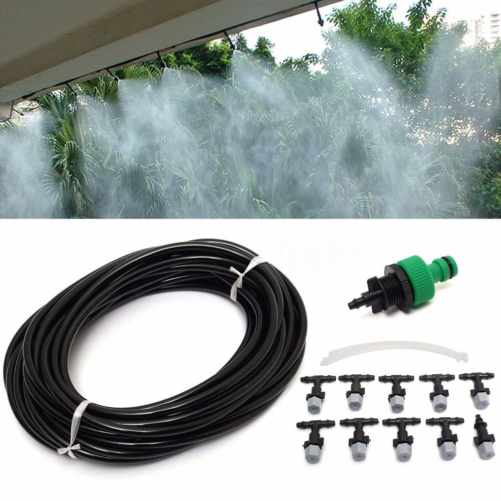 Kit nebulizzatore ad acqua: tubo nero arrotolato, ugelli e connettore verde