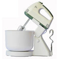 Mixer elettrico con fruste e ciotola, corpo beige con dettagli verdi.