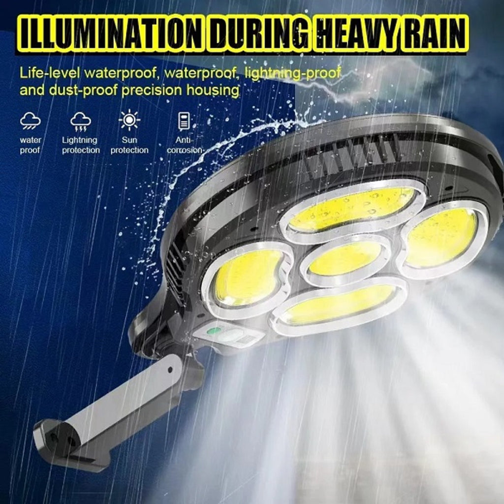 Proiettore solare nero con 5 LED COB e braccio regolabile, luce gialla.