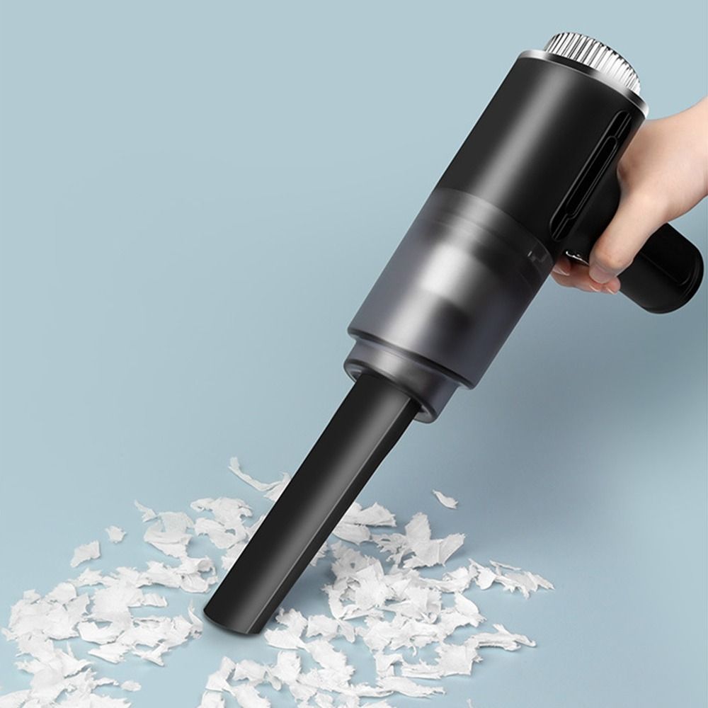 Aspiratore per auto portatile nero con spazzola per rimuovere detriti