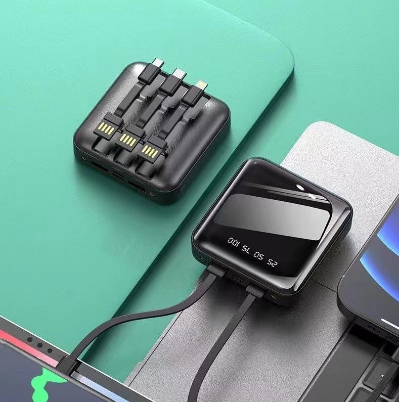 Power bank compatto nero con display LED e cavi integrati connettori