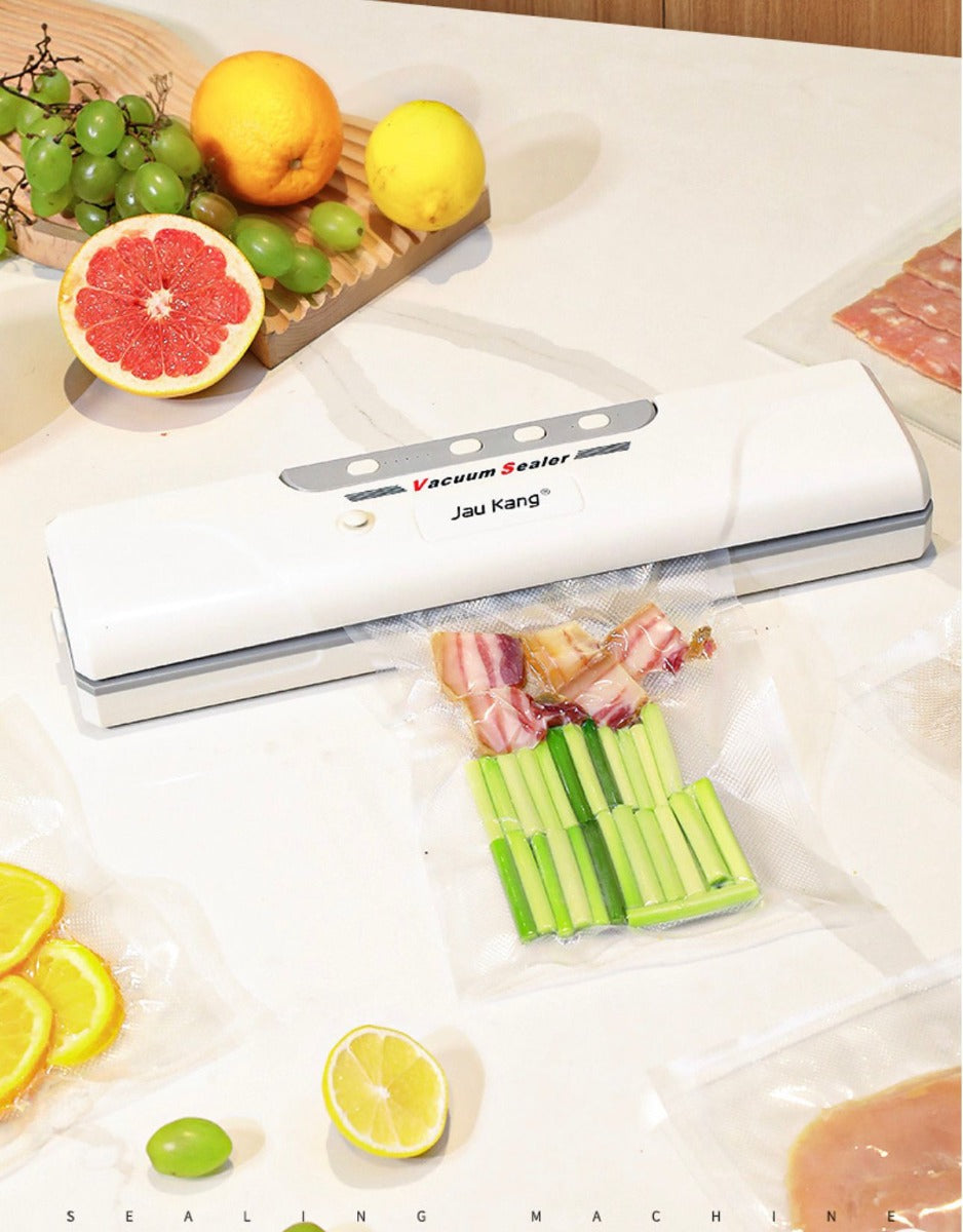 Macchina sottovuoto automatica bianca con barra di saldatura e sacchetti in plastica